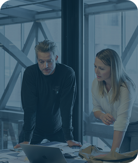 Two people looking at a computer screen